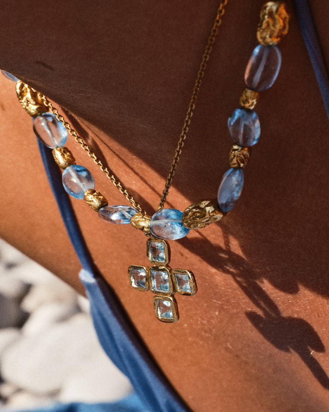 THE AQUA CROSS NECKLACE
